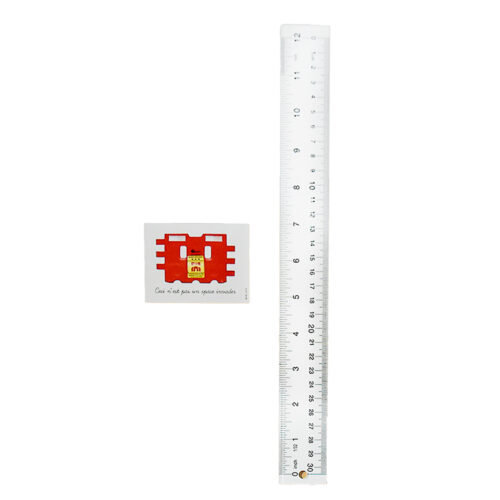 invader ceci n est pas sticker next to ruler for scale