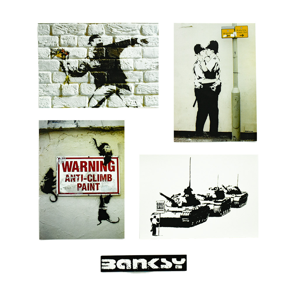 4 postcards shown with banksy band from the banksy wall and piece postcard set