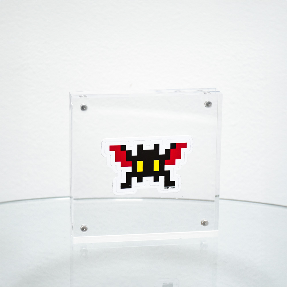 invader bat sticker in clear frame.