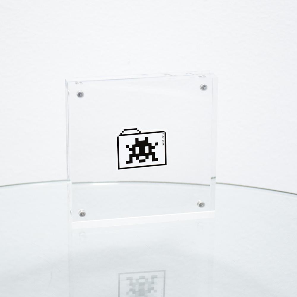 invader folder sticker in clear frame.