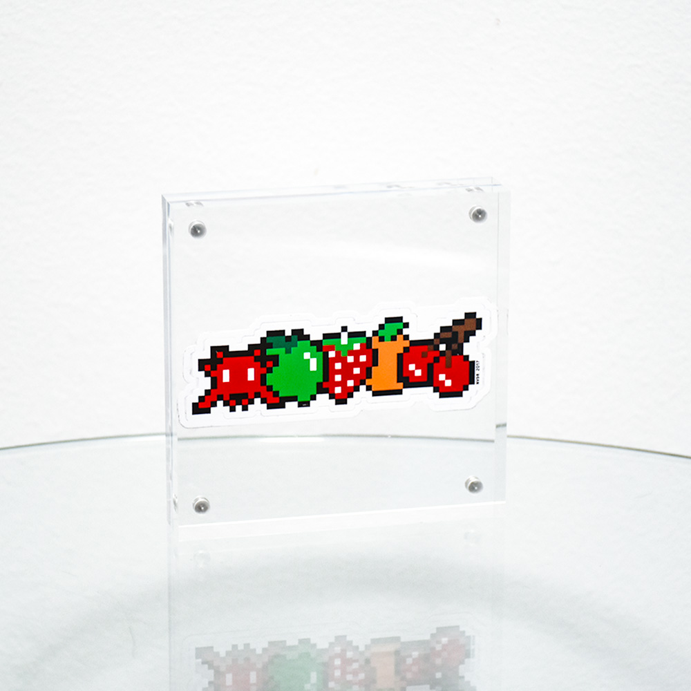 invader fruits sticker in clear frame.