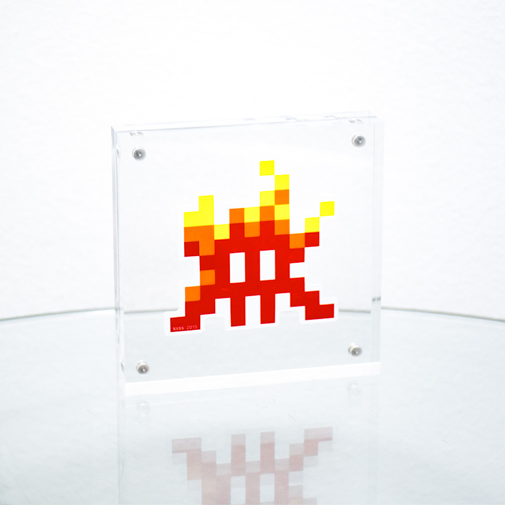 invader on fire sticker in clear frame.