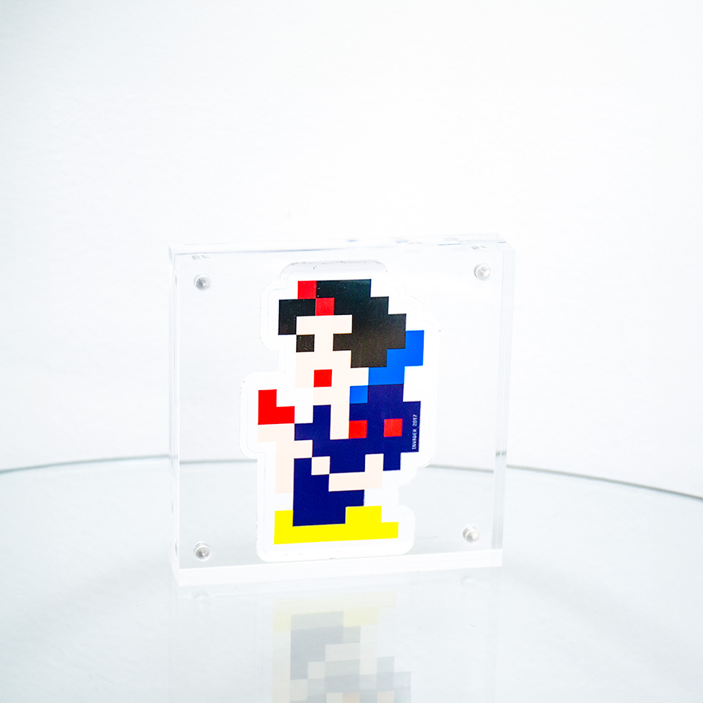 invader snow white sticker in clear frame.