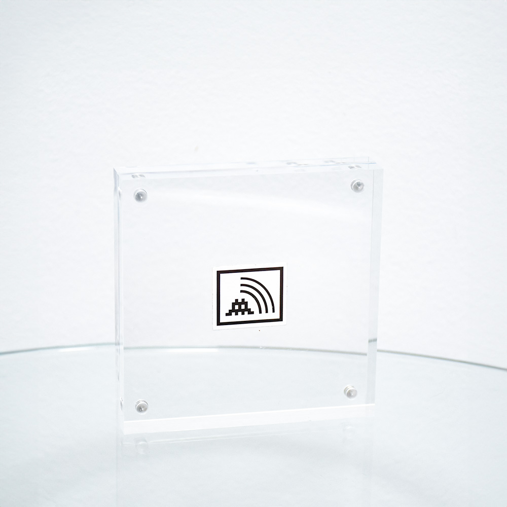 invader space vibes sticker in clear frame.