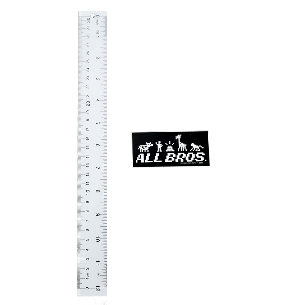 invader peta all bros sticker next to ruler