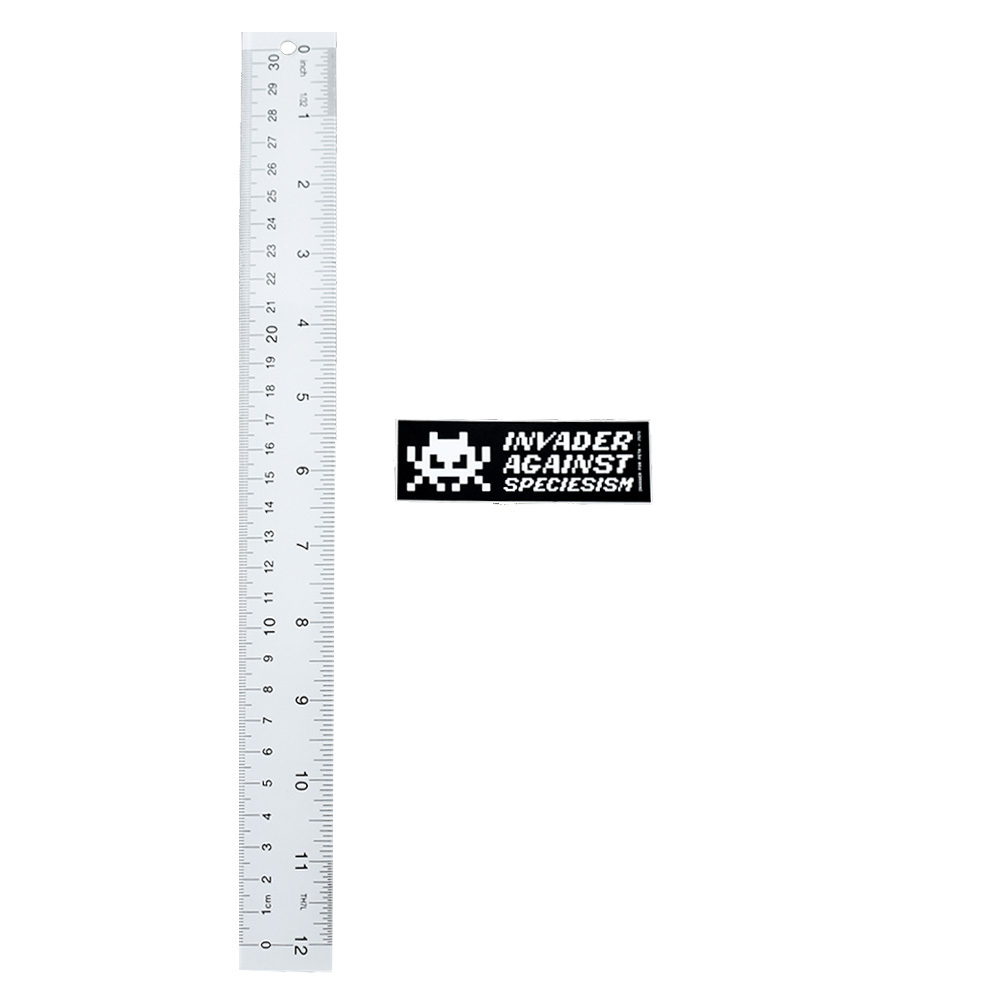 invader peta invader against speciesism sticker next to ruler