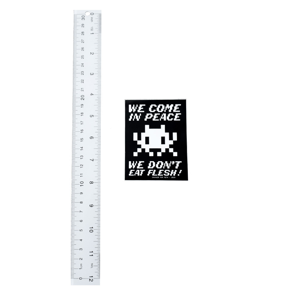 invader we come in peace sticker next to ruler