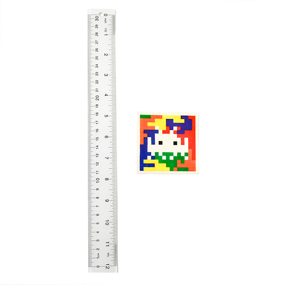 invader rubik space camo 3 sticker next to ruler