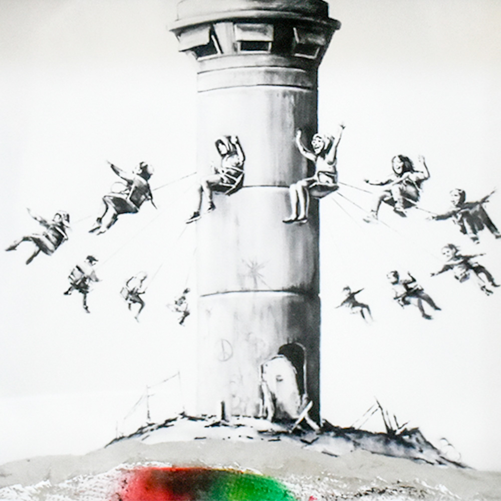 close up of print and concrete from banksy walled off hotel box set